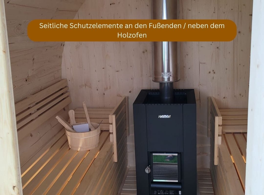 Holztechnik Montag Fasssauna mit Holzofen, Modell Ambiente, mit Schutzelementen neben Holzofen